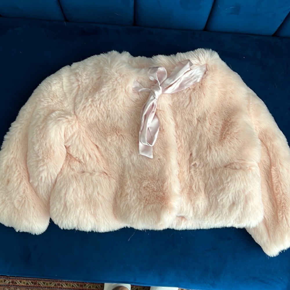 Brand new Sarah Louise England kids fair fur coat in baby pink.